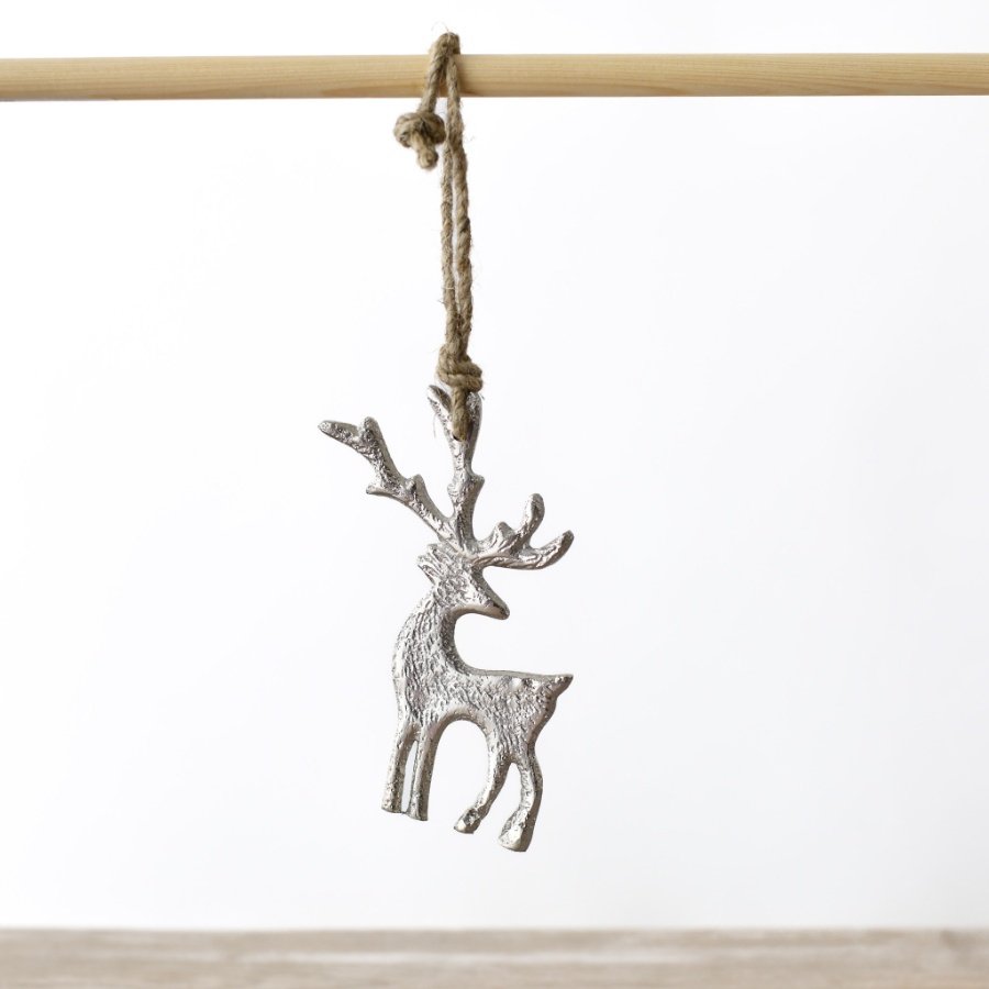 Celebrate the holidays in style with this modern reindeer ornament crafted from sleek metal.