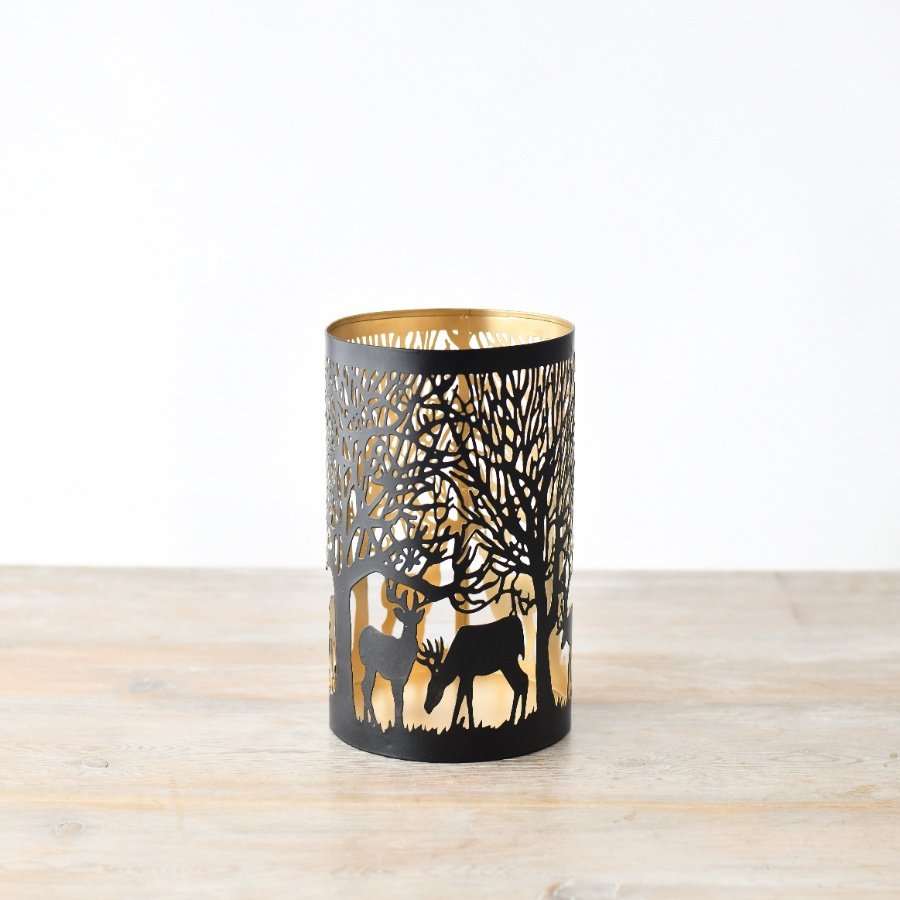 Add a touch of holiday joy with our beautiful reindeer-themed candle holder