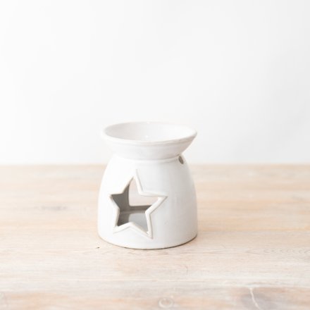 A star cut out oil burner in white with a simple glaze finish.