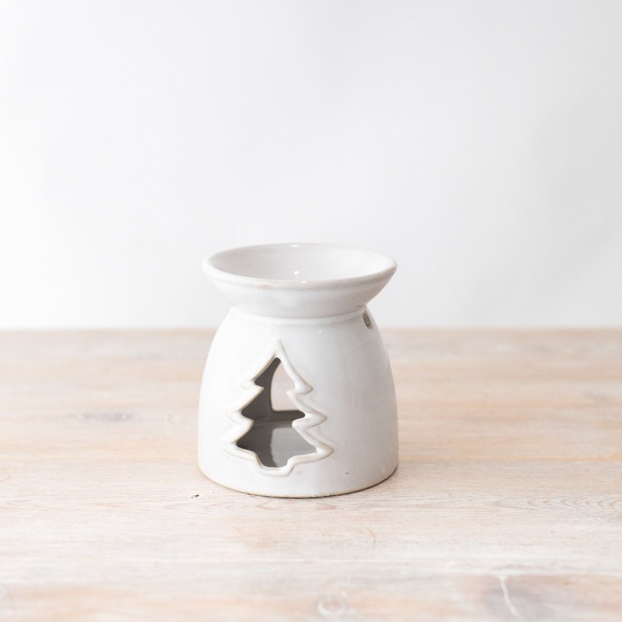 Enhance any room with this white oil burner featuring a unique tree cut out design, perfect for adding chic style