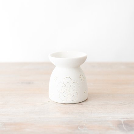 Add a floral and fragrant touch to the home with this oil and wax burner in white.