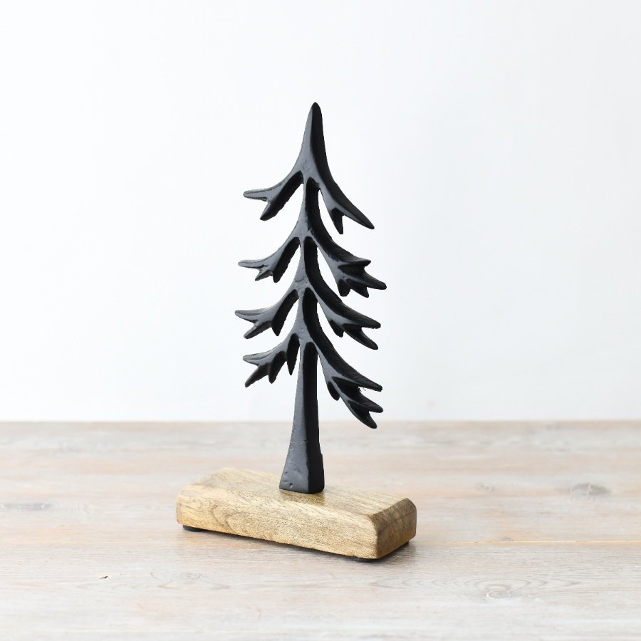 A beautifully stylish and chic Christmas tree made from iron and wood