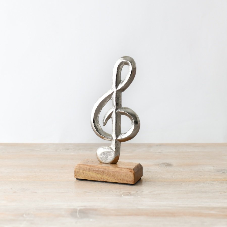 A Stylish Silver Treble Clef decoration on a wooden stand