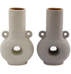 Add a classic touch to the interior with this tall abstract vase in 2 assorted designs. 
