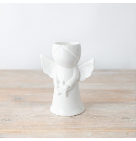 Enhance your space with this graceful oil burner featuring a charming white angel design. 