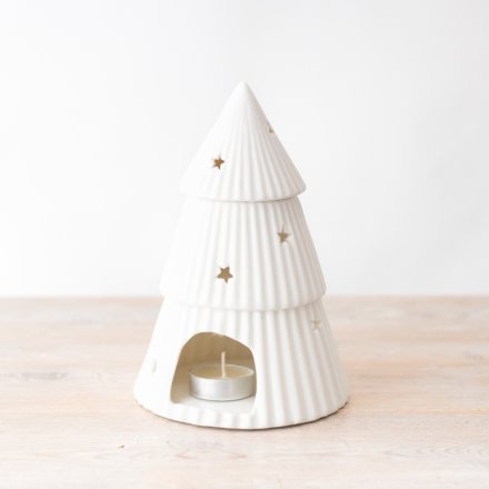A simple yet elegant oil burner in a Christmas tree design with mini cut out stars