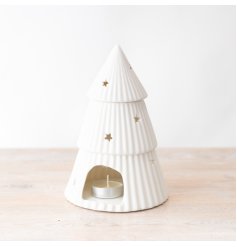 A simple yet elegant oil burner in a Christmas tree design with mini cut out stars