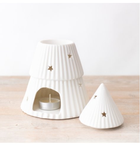A white Christmas tree oil burner with a ribbed effect and star design. 