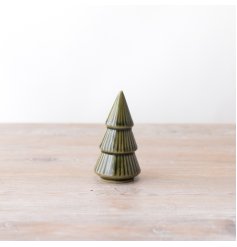 A gorgeous glazed Christmas tree standing ornament in a rich green colour tone. 