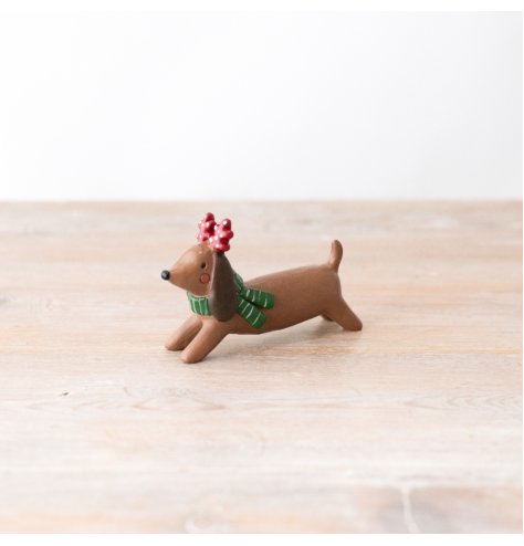 A cute and colourful dog ornament with fabulous festive details. 