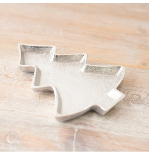 A stylish tree shaped dish with a textured surface. A decorative and functional seasonal item for the home.