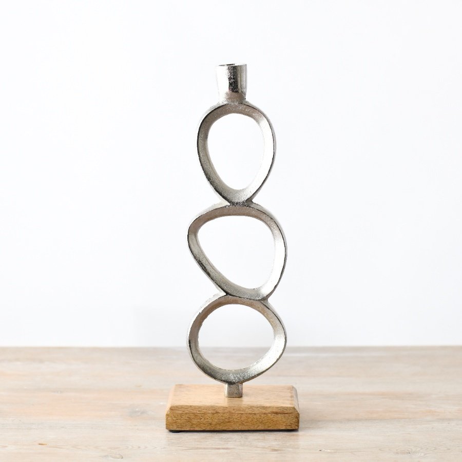 This hammered metal candle stick with a chrome finish is great for adding minimalistic style to the home.