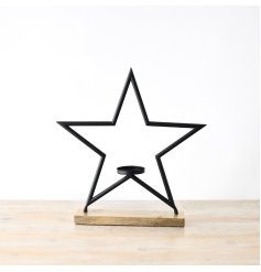 A sleek black star decoration with a central stand for a t light holder. 