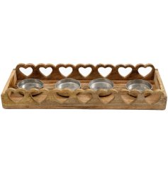 A lovely chunky candle holder with a rustic heart border. 