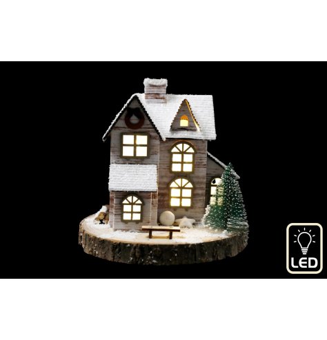 Effortlessly create a stunning focal point with our LED snow-covered house decoration. 