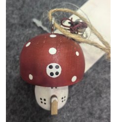 Add some whimsy to your festive decor with this charming hanging mushroom ornament. 