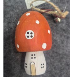 Add a touch of whimsy to your Christmas tree with this adorable ornament featuring an orange mushroom house