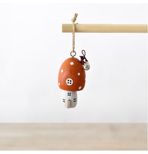 Add charm to your tree with this whimsical orange mushroom house ornament for the holidays.