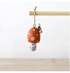 Add a touch of whimsy to your Christmas tree with this adorable ornament featuring an orange mushroom house
