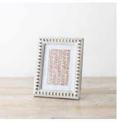 Elevate your photos with this beautiful frame. Perfect for showcasing your favorite images.