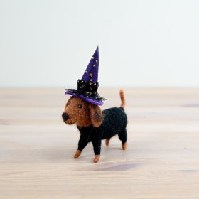 Celebrate Halloween with a charming wool dog decoration that's both spooky and adorable.