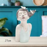 This lovely indoor figurine ornament seamlessly complements a variety of interior decor themes.