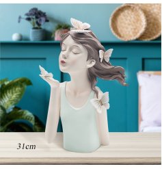 Elevate your decor with this elegant lady figurine, adding enchantment & sophistication to any room in your home.