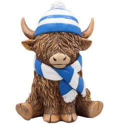 Infuse your decor with Scottish charm using this adorable figurine of a highland cow