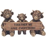 Embrace rustic charm with this stunning family of highland cow deco.