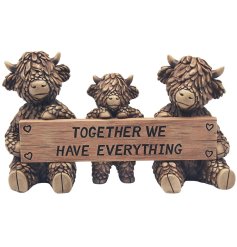 Embrace rustic charm with this stunning family of highland cow deco.