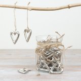 A gorgeous display of 30 raw silver hearts displayed in a glass jar. Each heart is hung on jute twine, making them perfe
