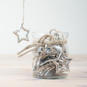 Unique silver star hangs with jar, the perfect decorative piece to add a touch of elegance to any room. 