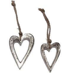 Add a charming touch to your decor with our lovely hanging silver heart. Perfect for refreshing your collection.