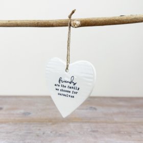 Charming white porcelain heart on jute twine with elegant scripted design. Perfect for a sentimental touch.