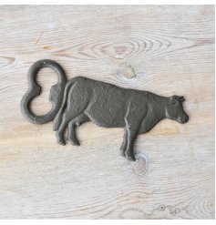 Rustic cow-themed bottle opener adds antique vibe to your collection. 