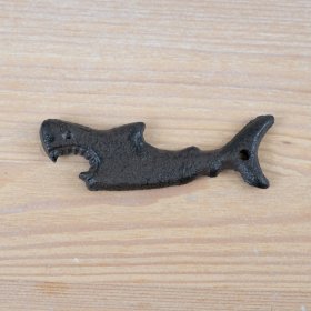 Introducing a durable, cast iron bottle opener with a rustic shark design. Perfect for cracking open a cold one! 