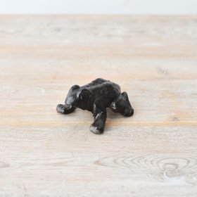 Adorable black frog ornament perfect for outdoor areas. Adds charm to any space! 