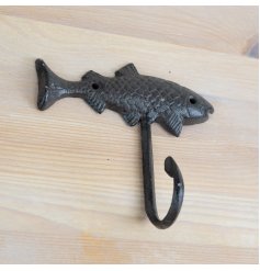 A rustic cast iron hook in a fish design. 