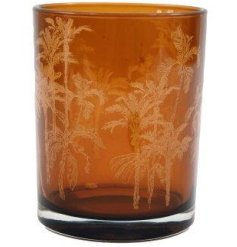 Indulge in the allure of this beautiful candle stand featuring chic palm tree designs in vibrant orange hues