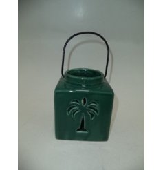 Create a tropical paradise in the home with this quaint lantern in green. 