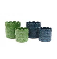 Enhance your home decor with our set of 2 stunning Scalloped Planters - perfect for indoor or outdoor use.