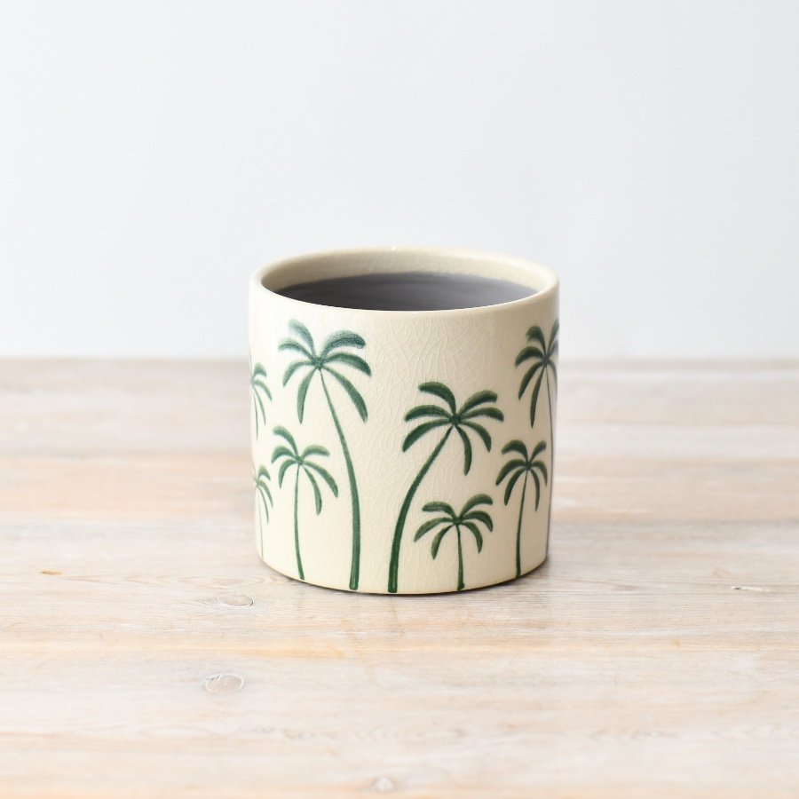 Enhance your space with this stunning indoor/outdoor palm planter, perfect for adding a touch of elegance to any room