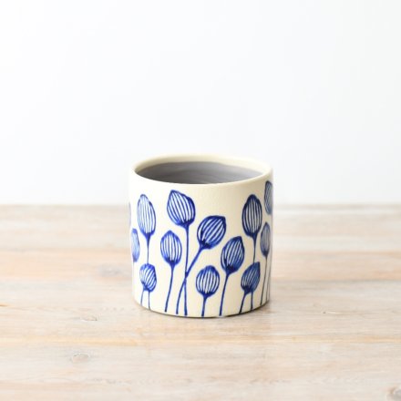 Liven up your home decor with our charming blue leaf plant pot, perfect for displaying your favorite potted plants. 
