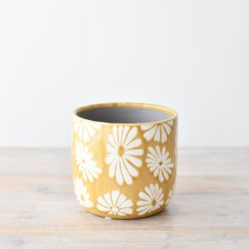 Add a touch of charm to your interior decor with this adorable flower-shaped planter