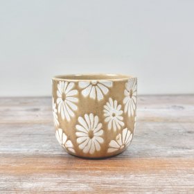 Add a touch of charm to your interior decor with this adorable flower-shaped planter