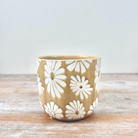 Refresh your beloved plants with this beautiful floral planter.