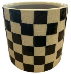 Add a touch of elegance to your home decor this stoneware planter featuring a unique black check design.