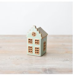 Illuminate your home decor with this adorable tiny house!