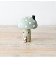 Bring a warm and inviting feel to your home with this charming mushroom house.