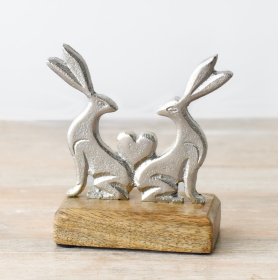 Adorn your space with a sweet rabbit figurine on a charming wooden base.